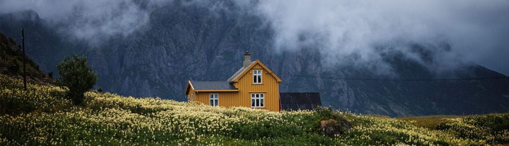 Home in a field with a mountain view